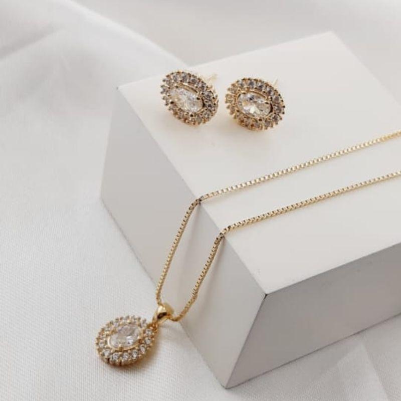 CONJUNTO CRAVEJADO OVAL OURO